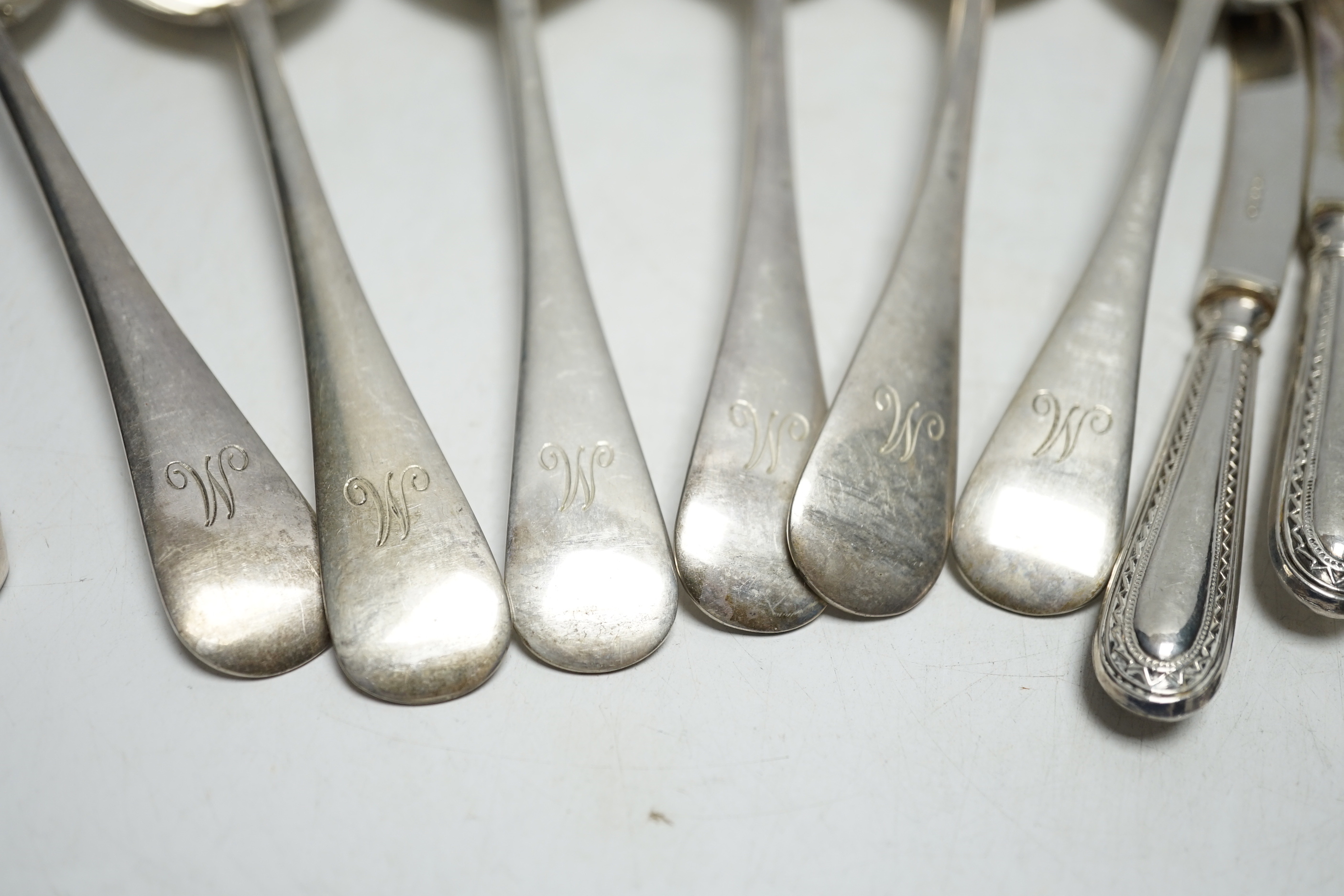 A set of six George V silver Old English pattern soup spoons, by James Dixon & Sons, a set of six silver handled tea knives and a pair of silver sugar tongs.